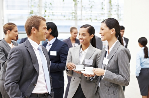 Business People Conversing at a Conference